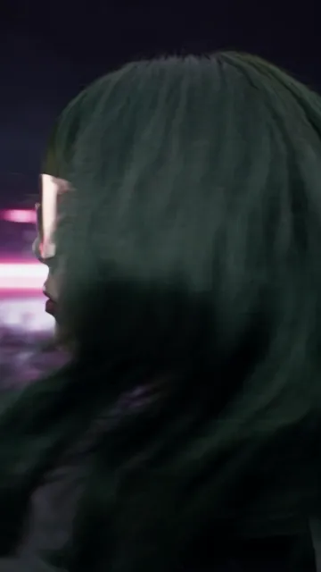Seedance 2.5 — Vertical futuristic blockbuster ad for pink sports shield glasses. Night, wet black floor, gloss