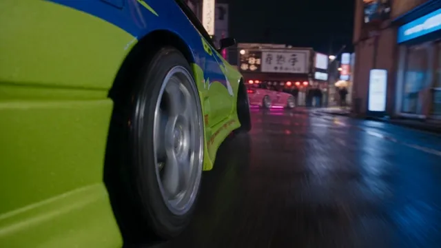 Seedance 2.5 — Two tuned Japanese street cars driven by two young women drift in close tandem through the narro